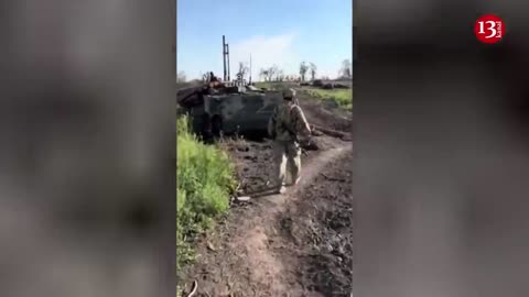 Ukrainian soldiers show the column of Russian equipment which they destroyed in Zaporizhzhia