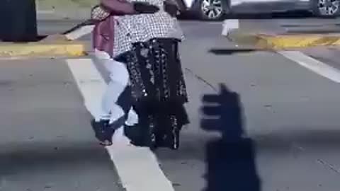 Man dances as two people