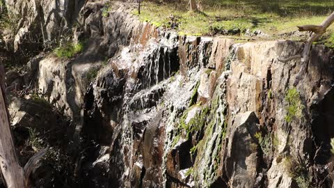 Water cascading across a waterfall in the Australian bush