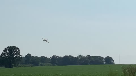 Yellow Crop-duster flying around