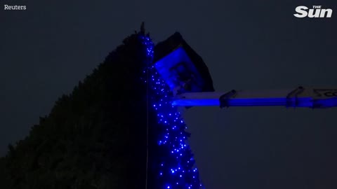 Ukrainians visit wartime Christmas tree installed in downtown Kyiv