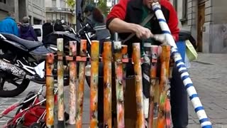 Street drummer wows spectators with plastic pipe jam