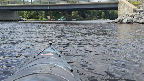 Kayaking under bridge and hitting waves