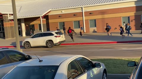 Mom Sings at Son as He Sprints into School