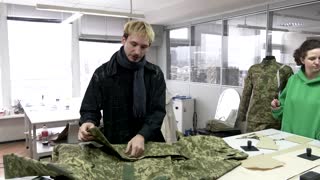 Volunteers make army uniforms for Ukrainian women