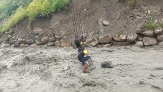 Workers Rescue Dog From Raging River