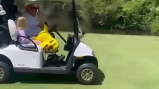 President Trump Goes Golfing With A Couple Special Guests - His Granddaughter & Pikachu