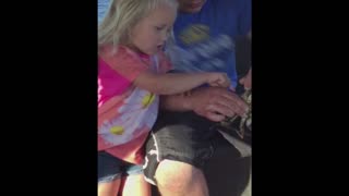 Girl Drops Crab on Dad's Lap