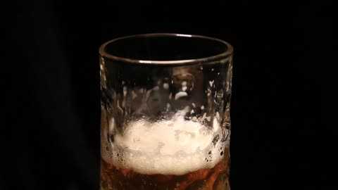 crystal glass for beer draught wheat video on a black background yellow beer