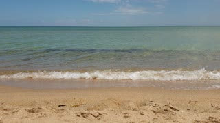 Soft gentle relaxing waves on a beach.