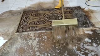 Washing the dirty carpet