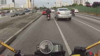 Motorcyclist Gets Distracted and Crashes