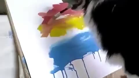 Talented dog knows how to paint. It is amazing.