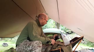 Getting the GoPro ready to film repositioning the tent