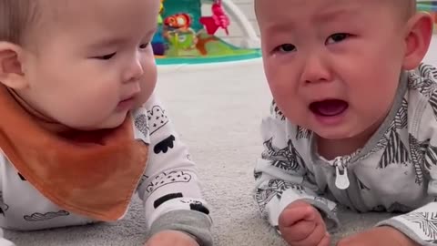 Two cute baby crying