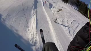 Paraglider Flies into Ski Lift Wire