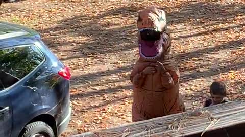 T-Rex Greets Kids School Bus