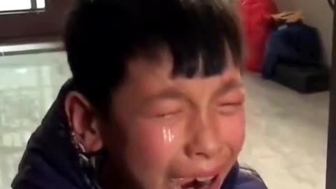 Chinese schoolboy bursts into tears of joy after achieving higher mark in exam