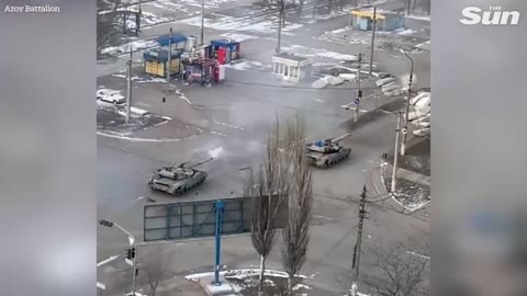 Footage appears to show Azov Battalion tanks firing down street in Mariupol, Ukraine