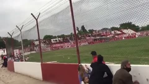 Fans take cover after head coach shot during football game in Argentina