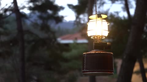 A lamp shining on a dark night