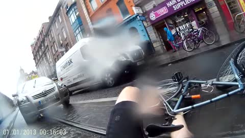 Guy on bicycle wipes out