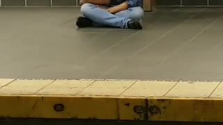 Blue flannel subway station sitting face down