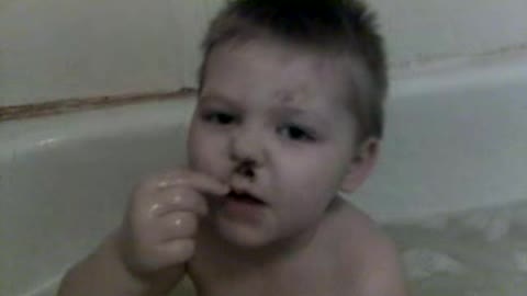 Boy Makes "Poop Mustache" On His Face During Bath Time