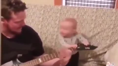 Baby dancing to the guitar