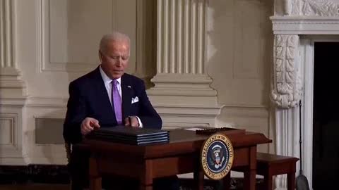 Joe Biden struggles with his pen