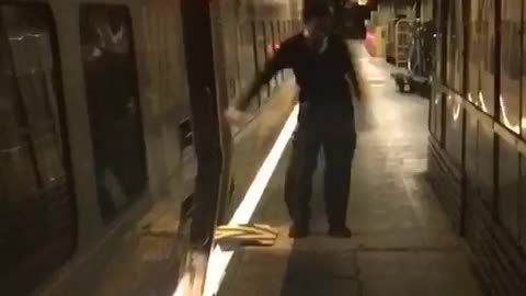 Guy doing the floss dance on subway platform