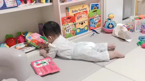 So So cute baby who likes books