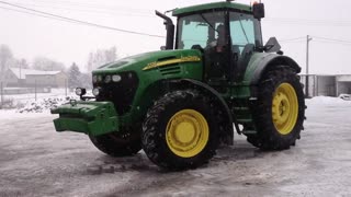 Driver Shows Drifting Skills With A John Deere Tractor