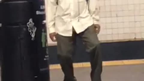 Guy green pants white dress shirt dancing subway station