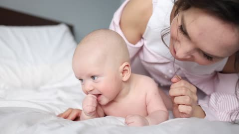 Baby and mom doing fun