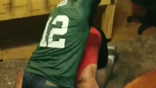 Guy green shirt gets tackled to ground