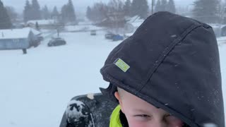 Sledding in Montana During Snow Storm