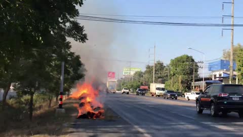 Truck Leaves Trail of Burning Bales