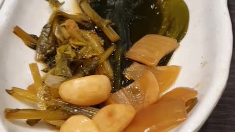 Various Korean pickles (Green onions, onions, a young radish, garlic )