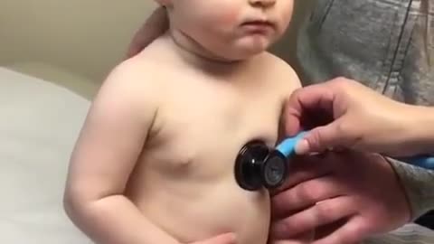 Sweet baby boy rests head on nurse's hand very Funny