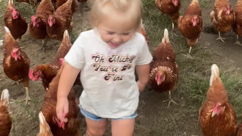 Adorable Little Girl And Her Army Of Chickens