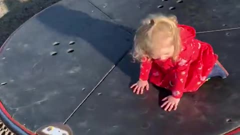 father SAVES DAUGHTER from falling off of Roundabout while playing on it
