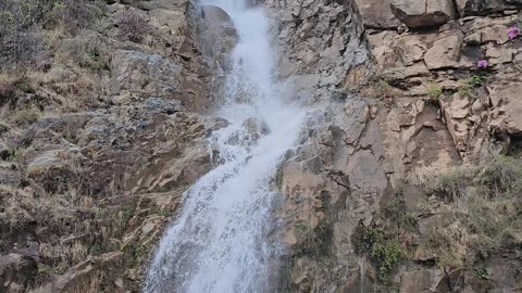 The video shows a stunning waterfall in Bani Minhsan, Azad Kashmir.
