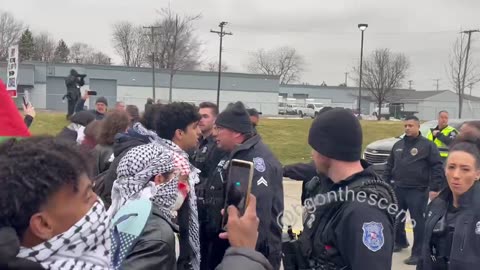 Pro-Palestine Protesters Push Against A Line Of Police Outside Joe Biden's Event In Warren, Michigan
