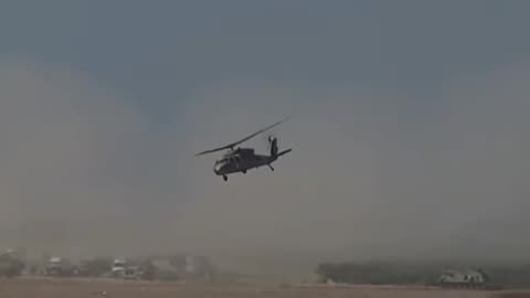 Military occupation helicopters transporting dead and wounded members