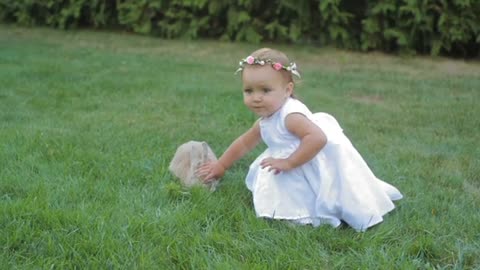 Little Girl Playing With Rabbit.