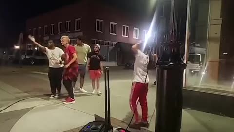 Man sucker punching a 12 year old boy dancing with his friends