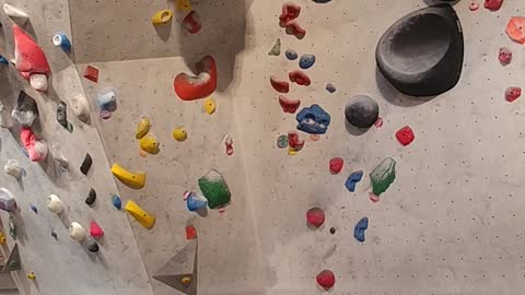 a young Korean man climbing