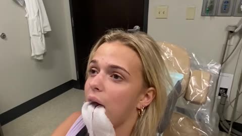 Girl sings National Anthem after having wisdom teeth surgery