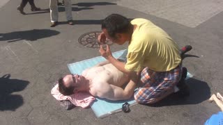 Luodong Massages Shirtless White Man With Glasses